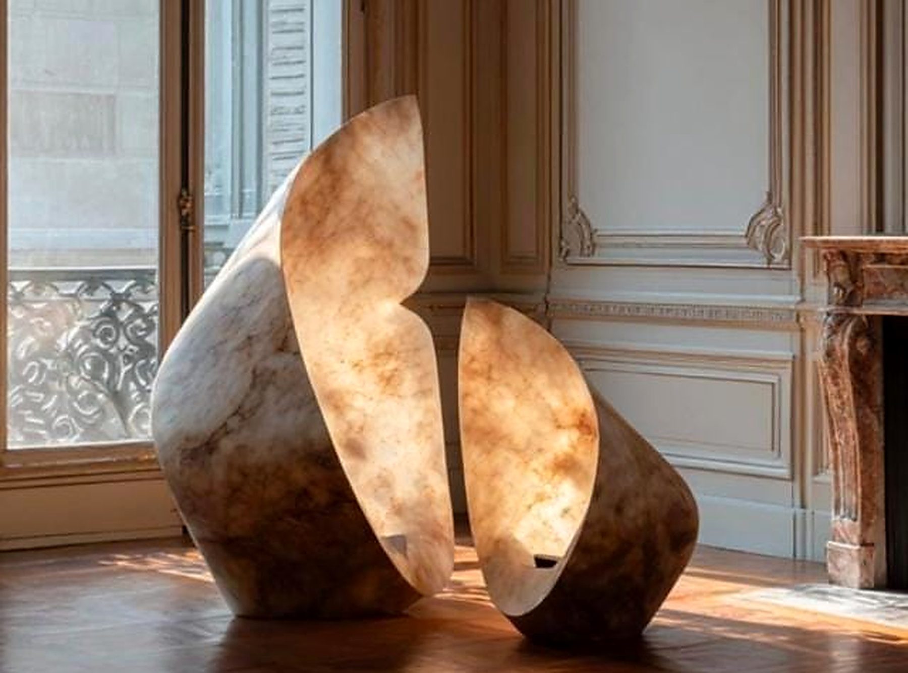 ONDINA, a sculptural marble light, lit from within in a panelled Lisbon interior